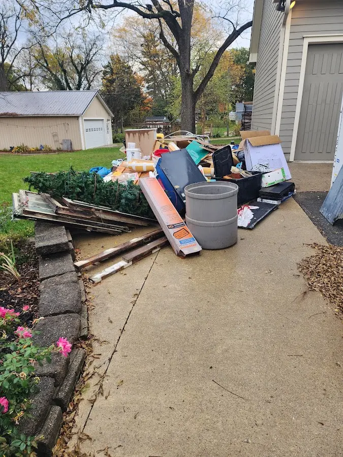 Dumpster being loaded with debris for Estate Cleanout Dumpster Rental in Centerville